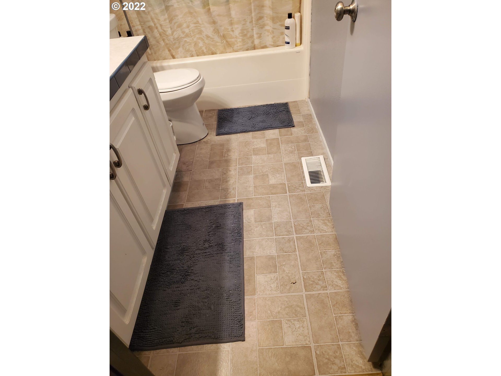 1949 Southeast Palmquist Road, Unit 77 Gresham, OR 97080 - Photo 10 of 30 a bathroom with a sink and toilet