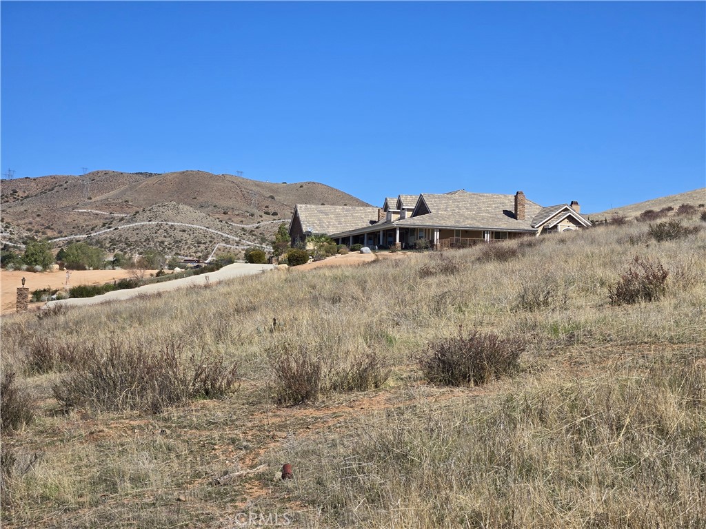 0 White Feather Road Acton, CA 93510 - Photo 13 of 24 a view of a dry yard with mountains in the background