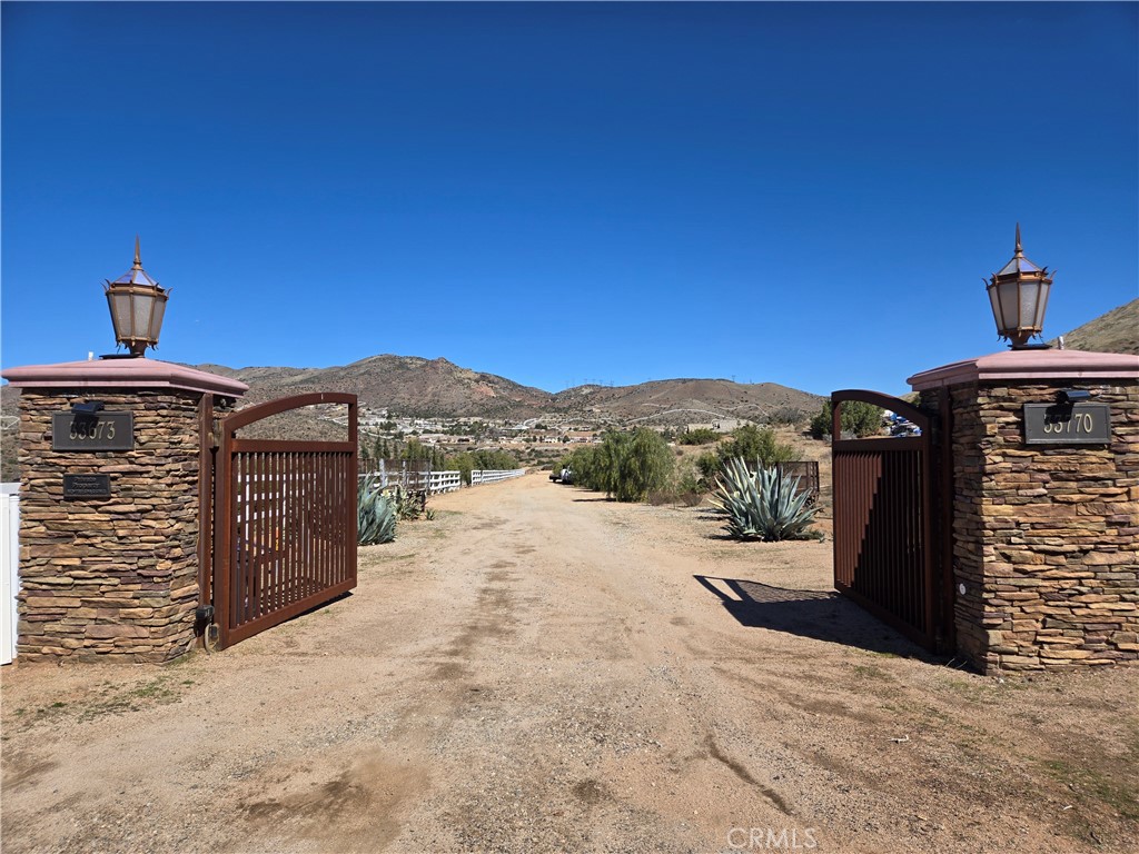 0 White Feather Road Acton, CA 93510 - Photo 2 of 24 a front view of a house with a yard