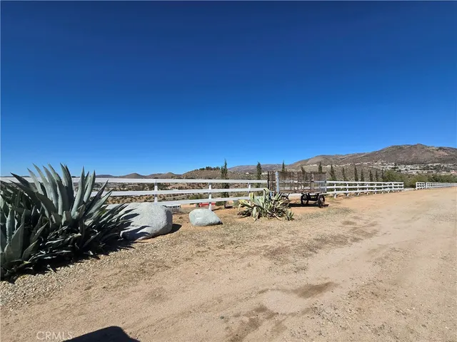 a view of a large building with a yard