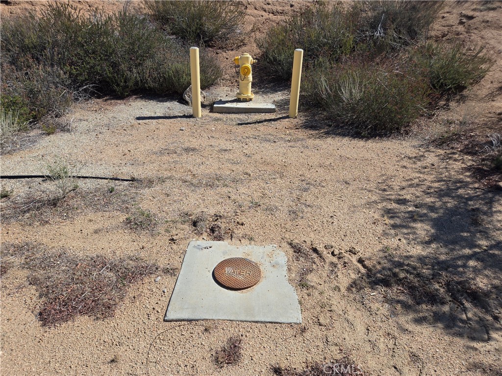 0 White Feather Road Acton, CA 93510 - Photo 7 of 24 a backyard of a house with table and chairs