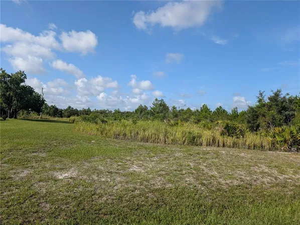 a view of a golf course with a lake