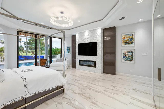 a view of a backyard with plants and lake view