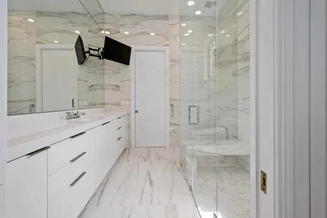 an aerial view of a house with swimming pool and a yard