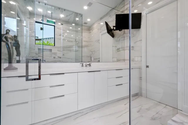 a view of a lake with houses in the back