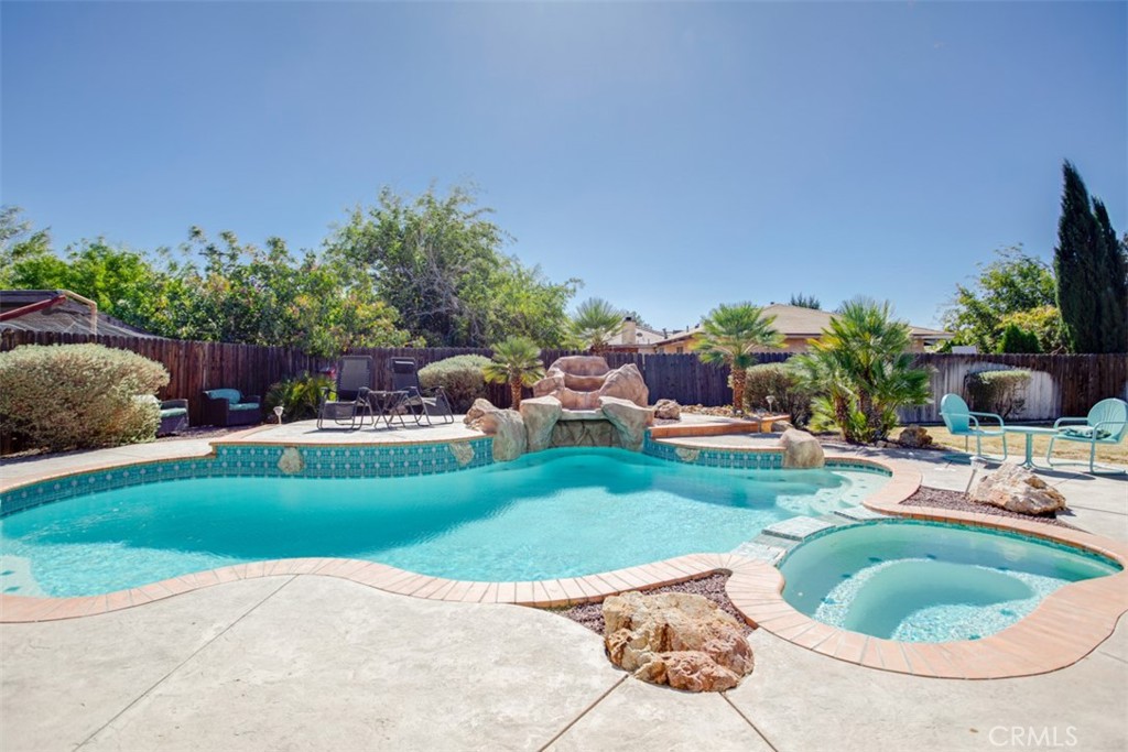 21789 Thunderbird Road Apple Valley, CA 92307 - Photo 1 of 1 a view of a backyard with sitting area