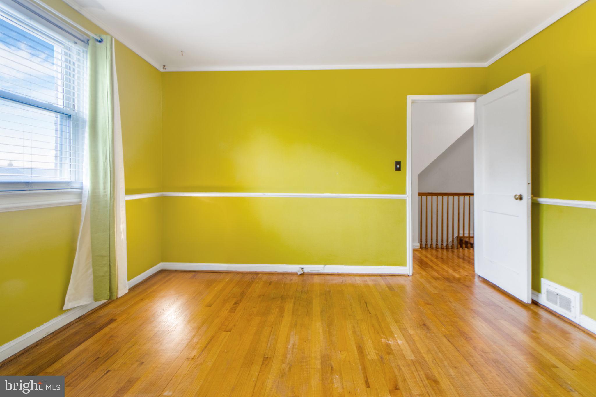 1903 Heathfield Road Baltimore, MD 21239 - Photo 18 of 30 a view of a big room with wooden floor