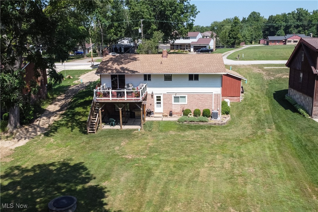 15485 Albion Road Strongsville, OH 44136 - Photo 33 of 36 Stunning aerial perspective of the deck and back of the home—picture yourself relaxing and entertaining here.