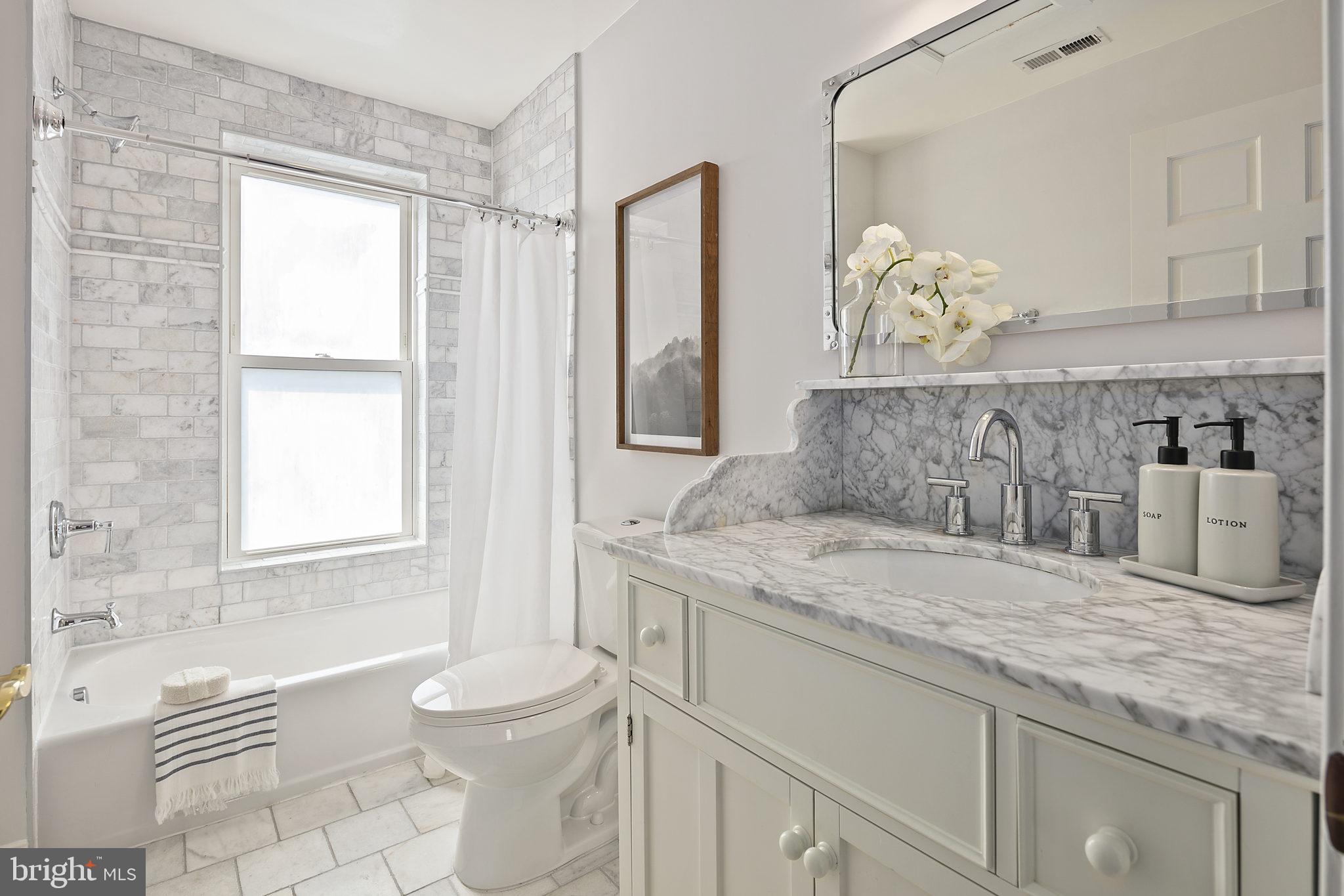 523 F Street Northeast Washington, DC 20002 - Photo 30 of 38 Features marble tile and a bathtub/shower combo
