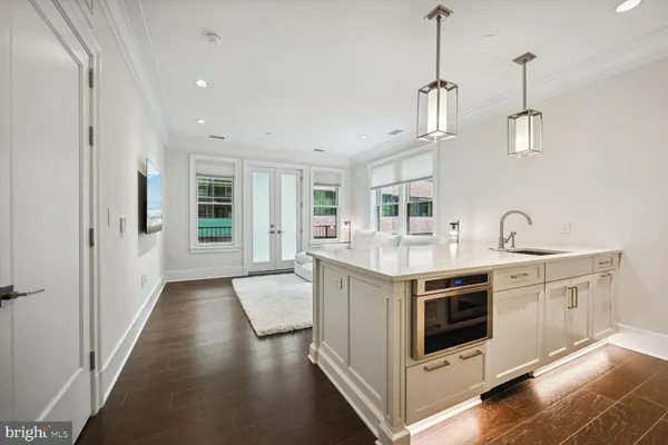 a kitchen with stainless steel appliances granite countertop a stove and a sink