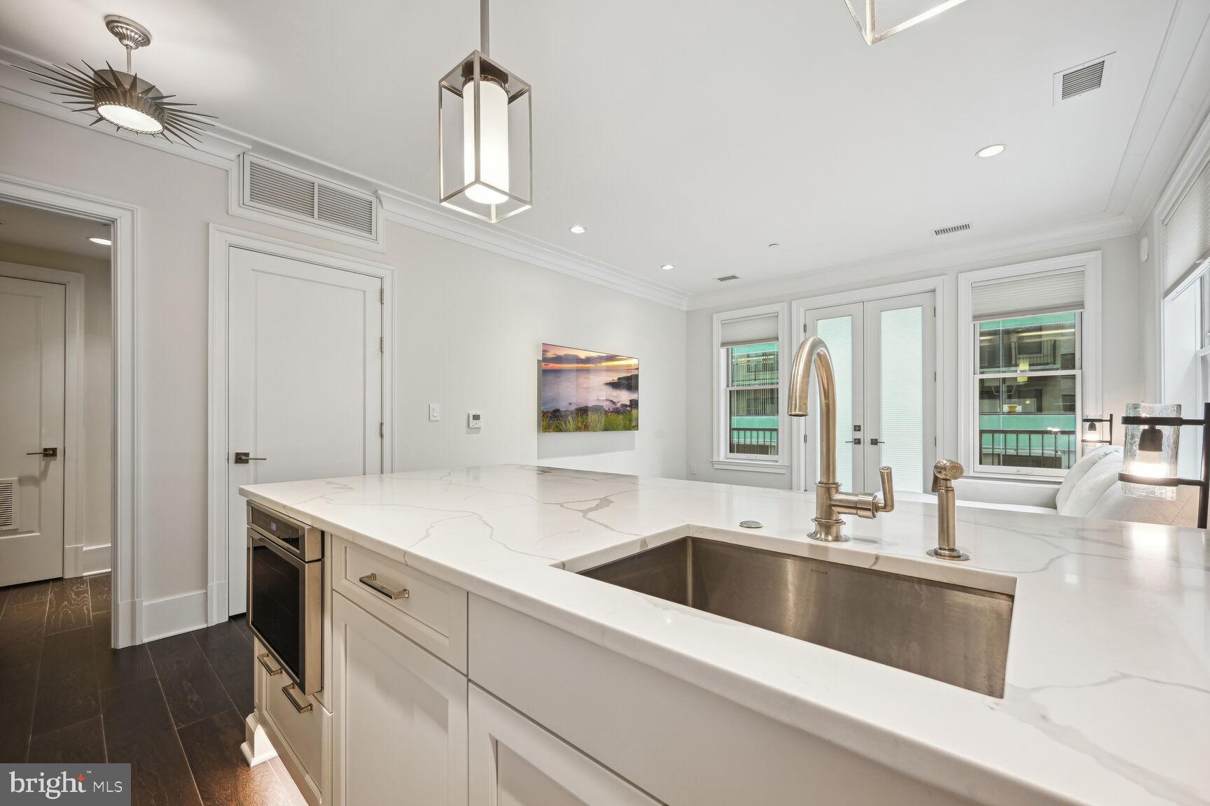 1108 16th Street Northwest, Unit 604 Washington, DC 20036 - Photo 6 of 20 Sleek modern kitchen with elegant finishes.