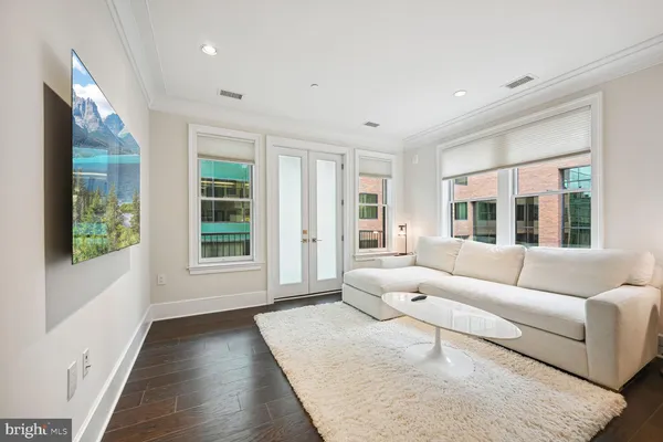 a living room with furniture and windows