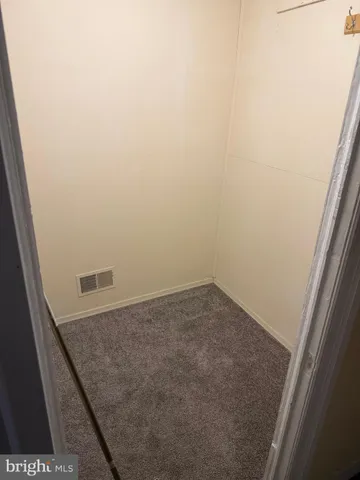 a bathroom with a toilet sink and a mirror