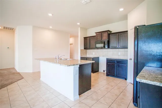 a large kitchen with cabinets