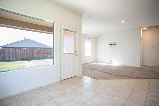 a view of an empty room and window