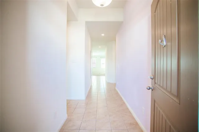 a view of a hallway with a white walls