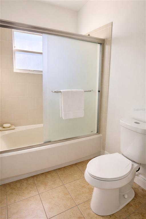 10849 Wheaton Court Orlando, FL 32821 - Photo 11 of 16 a bathroom with a toilet and a bathtub