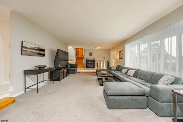 a bed room with a bed and a television