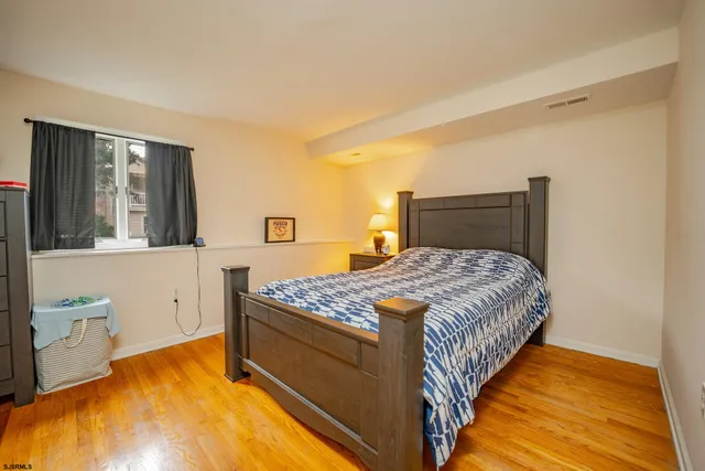a balcony with wooden floor and city view