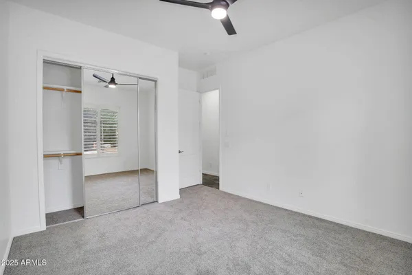 an empty room with a empty space and windows