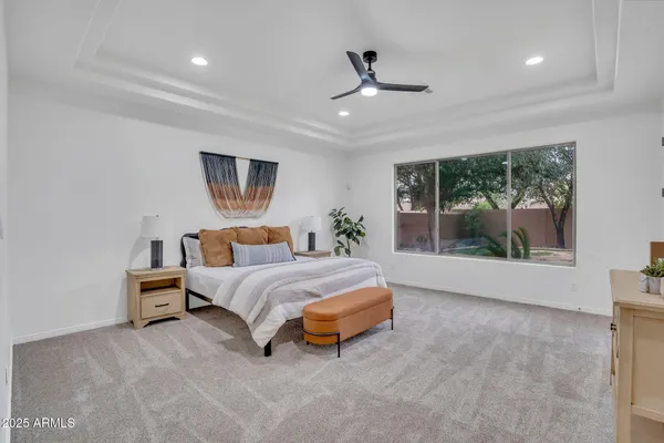 a bathroom with a double vanity sink and a toilet