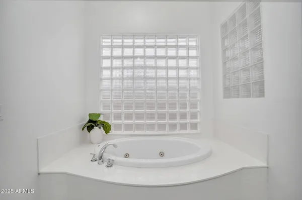 a bathroom with a sink double vanity and a mirror