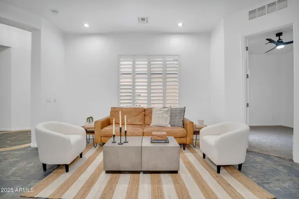 a living room with furniture and a window