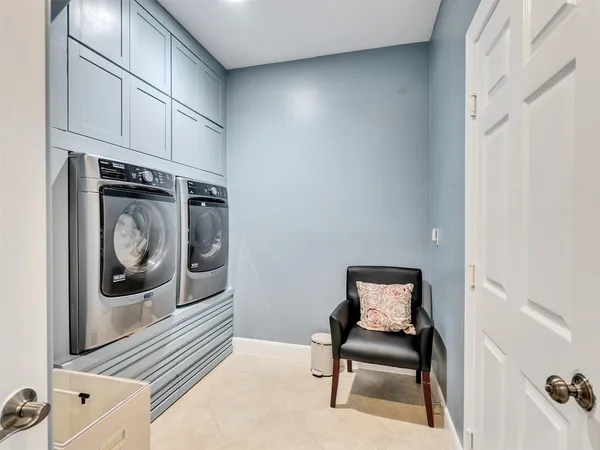 a view of a hallway with washer and dryer