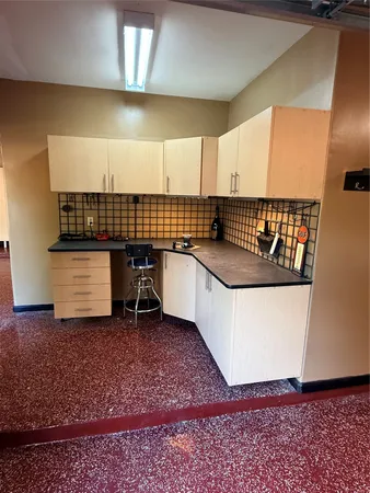 a kitchen with a sink and a refrigerator