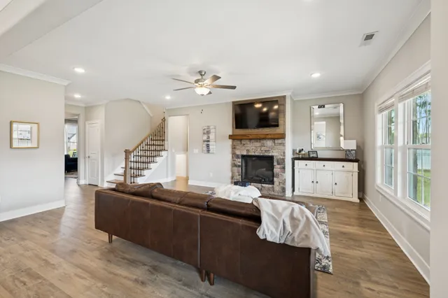 a kitchen with stainless steel appliances granite countertop a refrigerator a stove a sink and a refrigerator