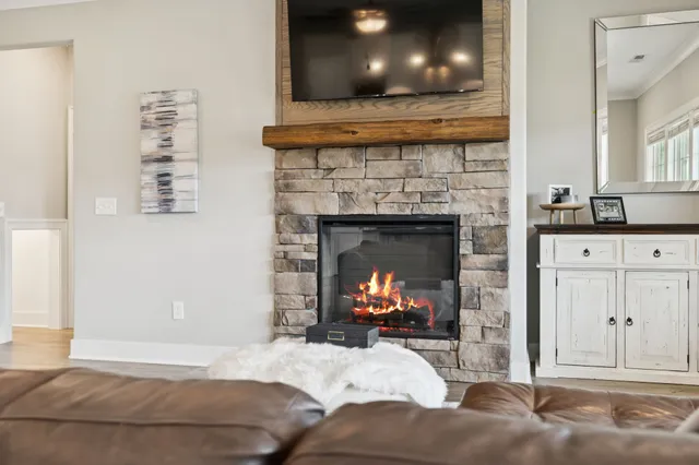 a kitchen with stainless steel appliances granite countertop a refrigerator a sink and a stove