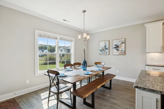 a spacious bathroom with a granite countertop sink and a mirror
