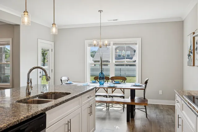 a spacious bedroom with a bed and a table