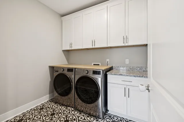 a spacious bedroom with a bed and a ceiling fan
