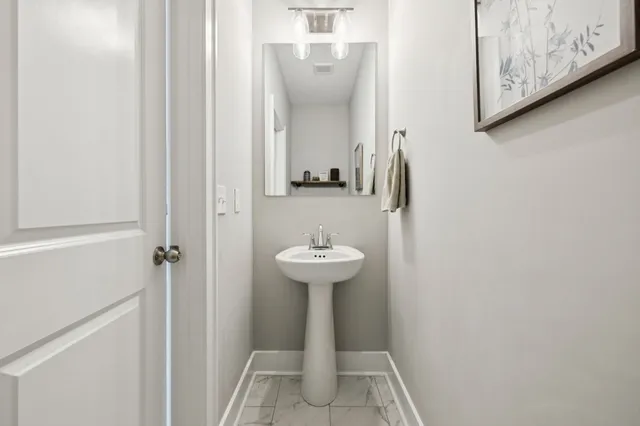 a white bath tub sitting next to a shower