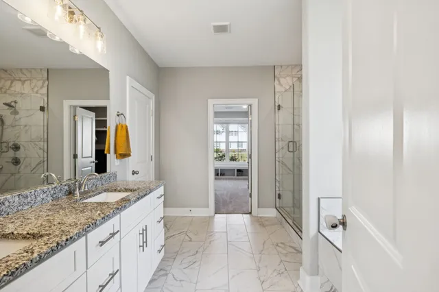 a bathroom with a shower and a bathtub