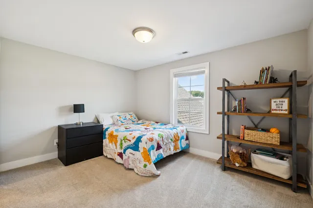 a front view of a house with a garden and porch