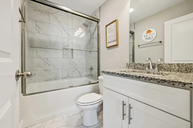 a front view of a house with a garden and porch