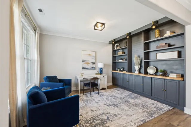 a living room with furniture fireplace and flat screen tv