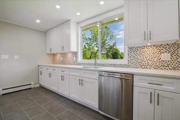 a bathroom with a sink vanity and a mirror
