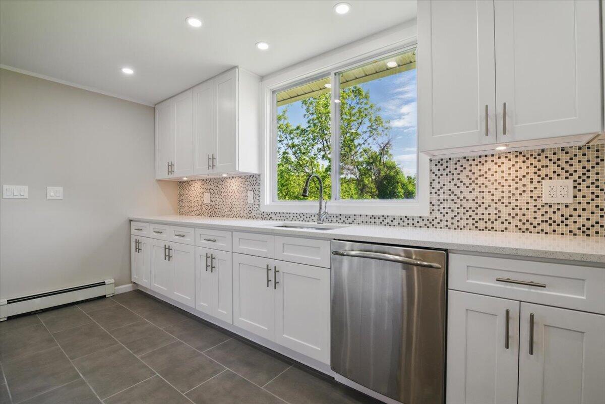 1652 Bonser Road Saylorsburg, PA 18353 - Photo 11 of 62 a kitchen with a sink window and cabinets