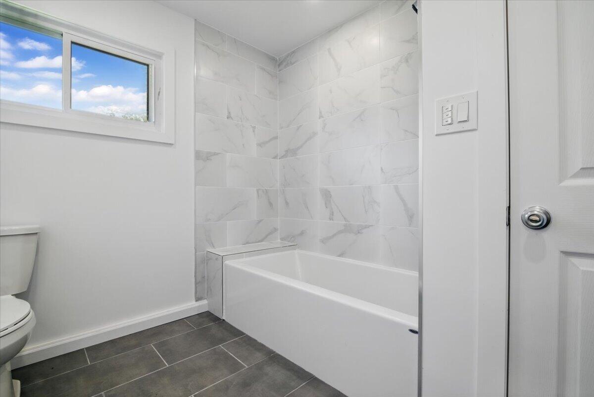 1652 Bonser Road Saylorsburg, PA 18353 - Photo 15 of 62 a white bath tub sitting next to a white toilet