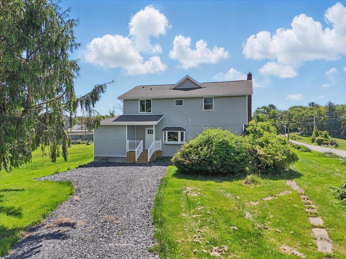 1652 Bonser Road Saylorsburg, PA 18353 - Photo 2 of 62 a front view of a house with garden
