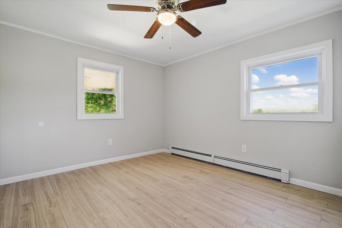 1652 Bonser Road Saylorsburg, PA 18353 - Photo 23 of 62 a view of an empty room with wooden floor and a window