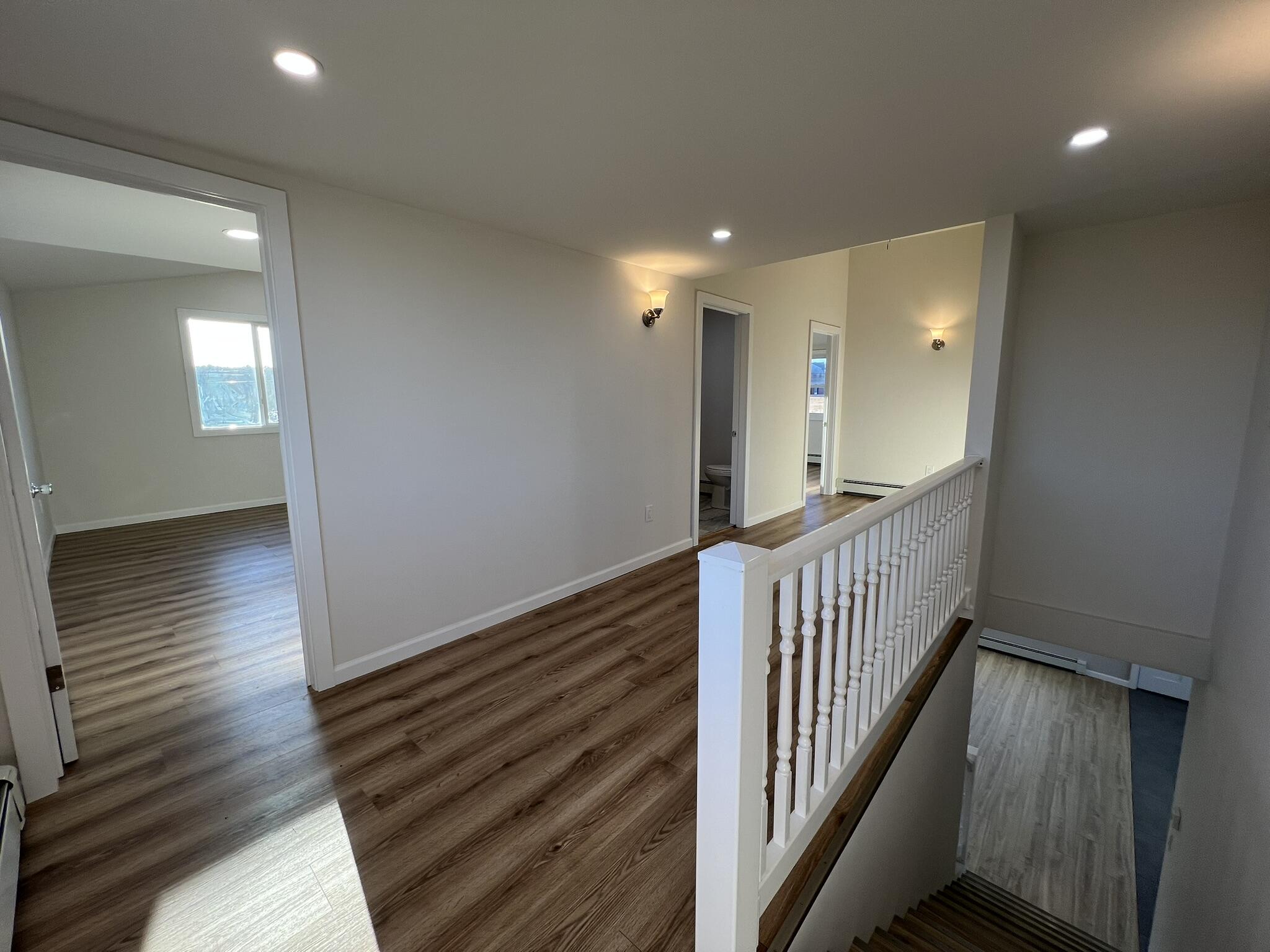 1652 Bonser Road Saylorsburg, PA 18353 - Photo 26 of 62 a view of a hallway view with wooden floor and staircase