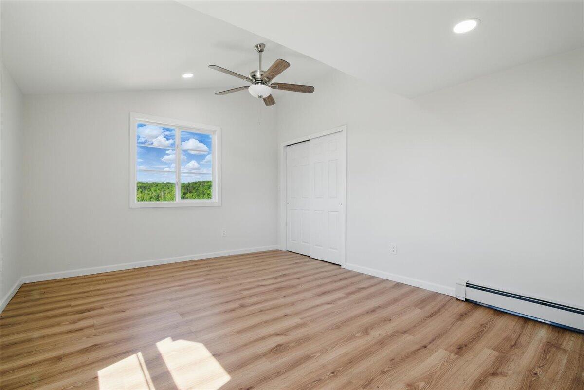 1652 Bonser Road Saylorsburg, PA 18353 - Photo 28 of 62 a view of empty room with wooden floor and fan