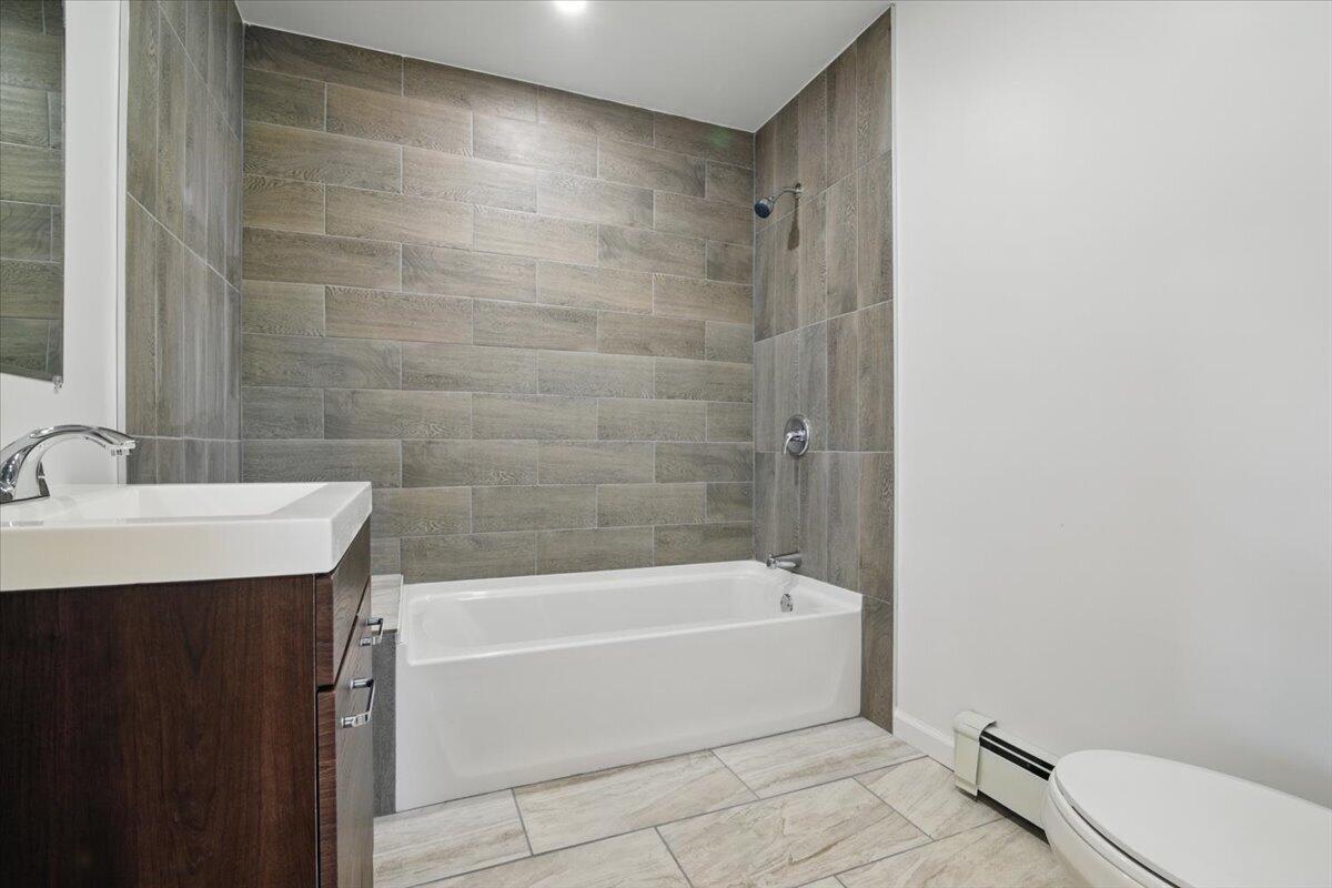 1652 Bonser Road Saylorsburg, PA 18353 - Photo 30 of 62 a bathroom with a bathtub and a sink