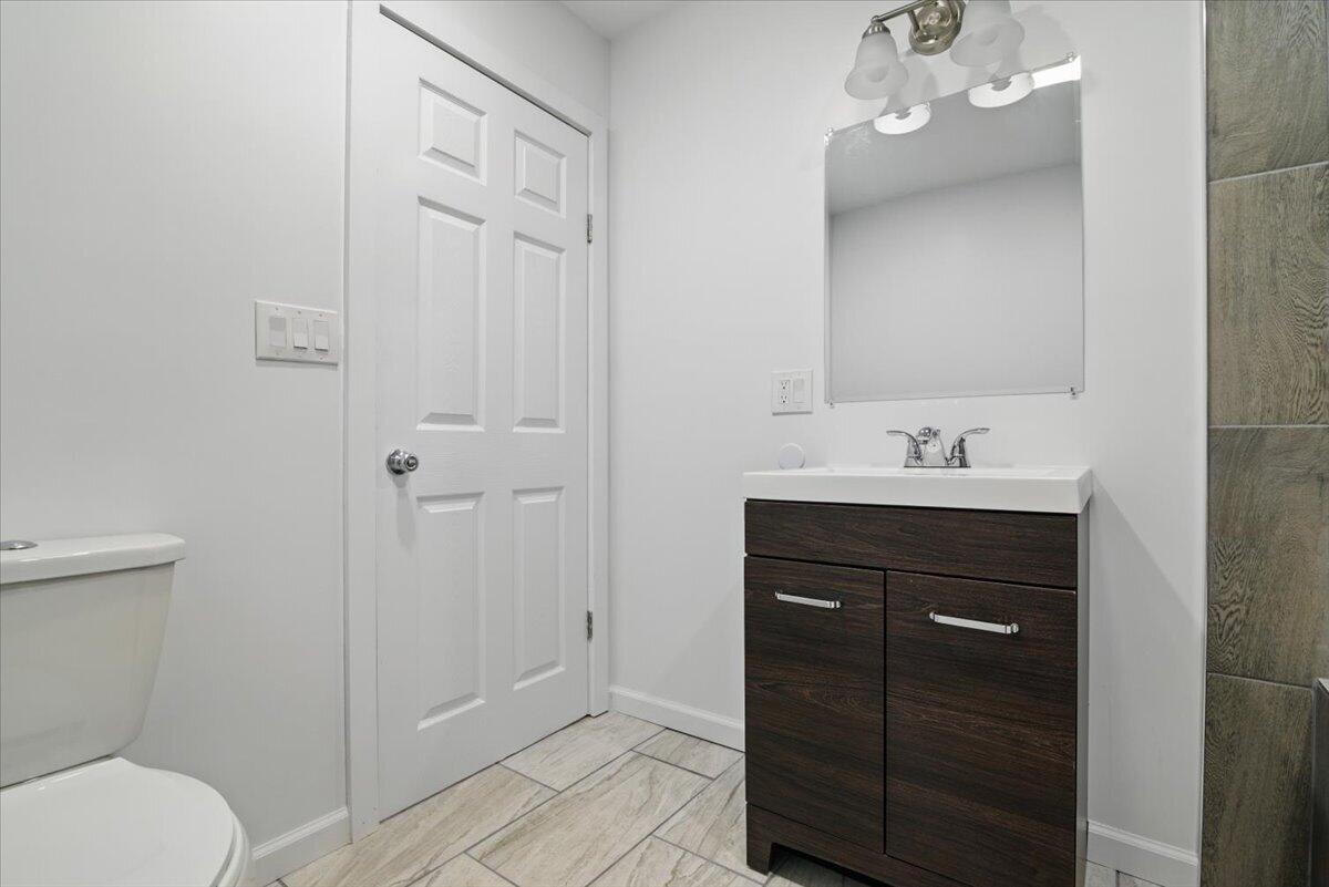 1652 Bonser Road Saylorsburg, PA 18353 - Photo 31 of 62 a bathroom with a sink vanity and toilet