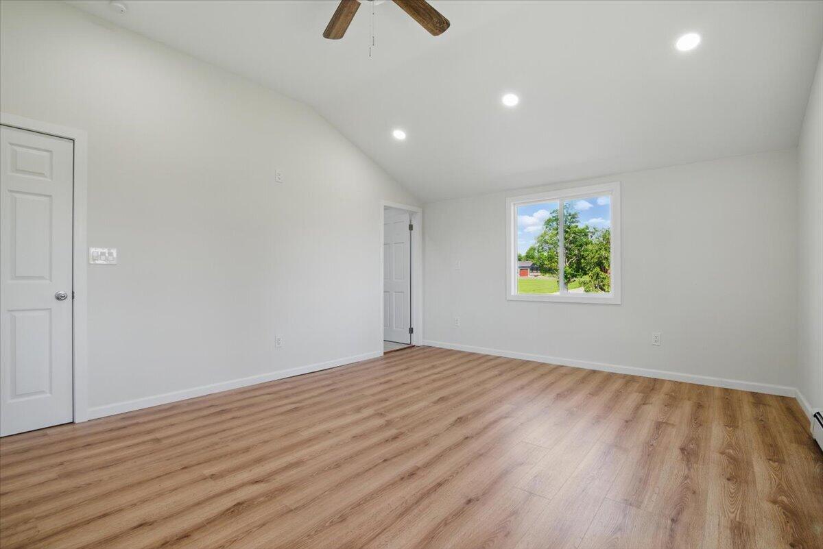 1652 Bonser Road Saylorsburg, PA 18353 - Photo 36 of 62 a view of an empty room with wooden floor and a window
