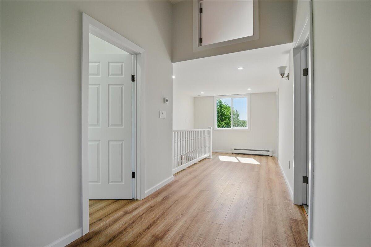 1652 Bonser Road Saylorsburg, PA 18353 - Photo 39 of 62 a view of an empty room with wooden floor and a window